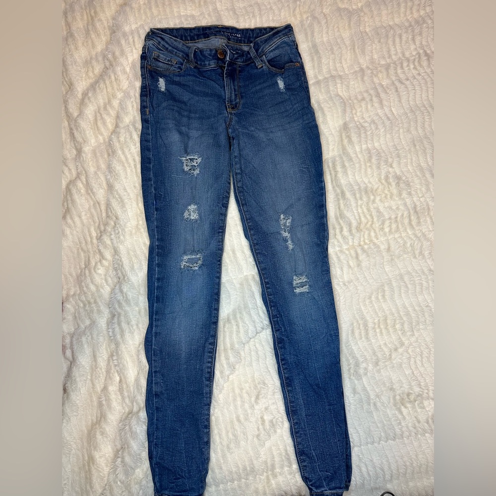 Ripped old navy blue jeans